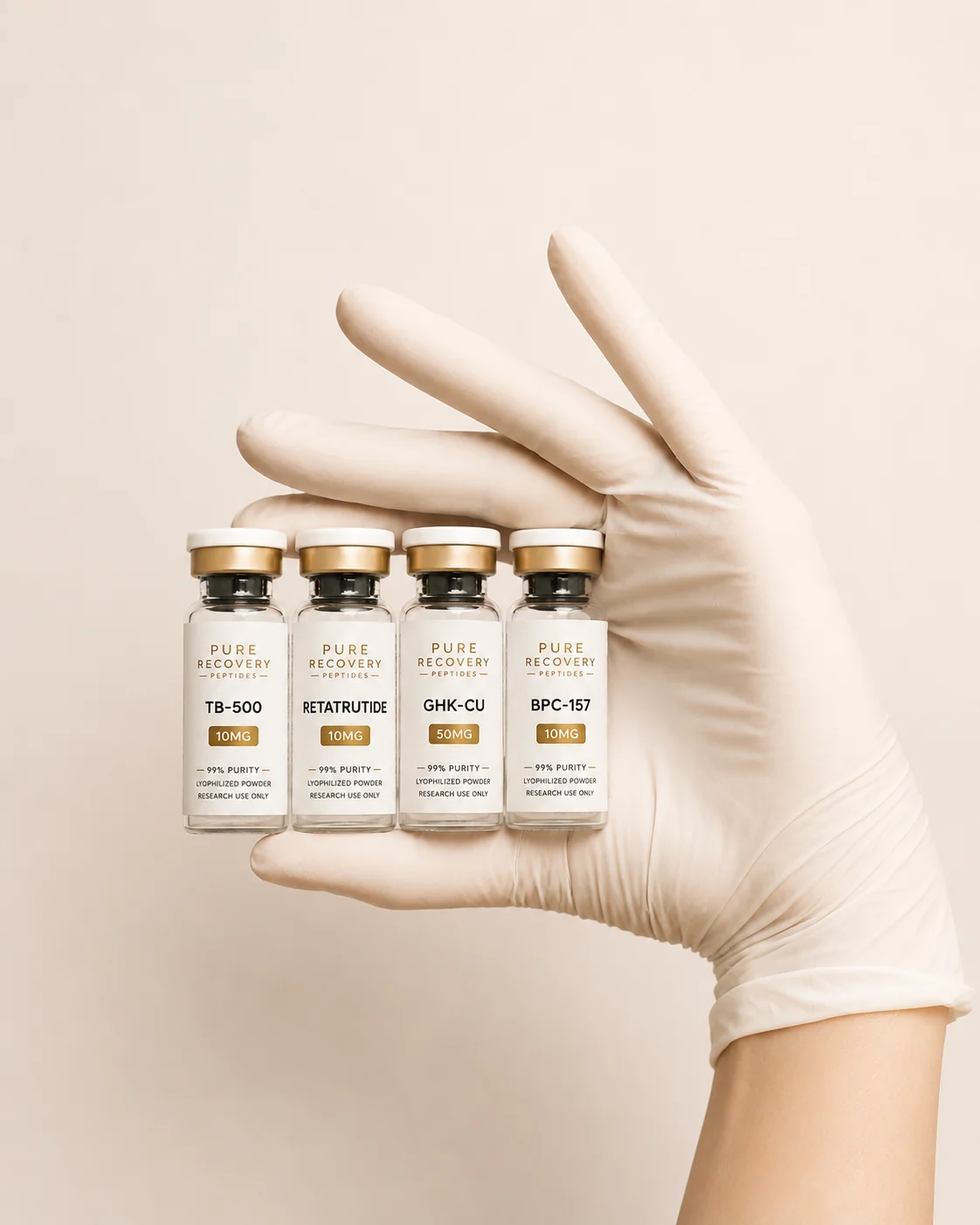 Gloved laboratory hand holding four Pure Recovery Labs research peptide vials